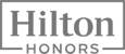 This image shows the "Hilton Honors" logo, displaying the brand name in a bold font.